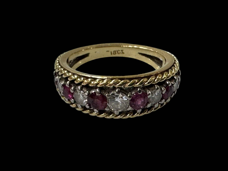 Ruby and diamond eleven stone 18 carat gold ring, size N.