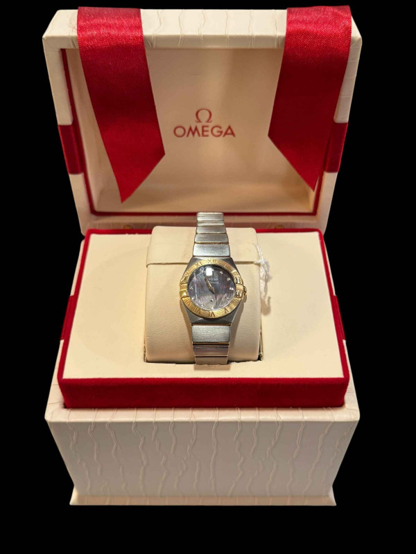 Good ladies Omega Constellation quartz watch in stainless steel and 18 carat yellow gold with mother of pearl diamond set dial, in little used condition and with box, papers and travel case, serviced in 2021 at a cost of £450.