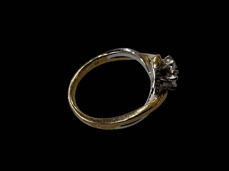 9 carat yellow and white gold twist design diamond ring, size M.