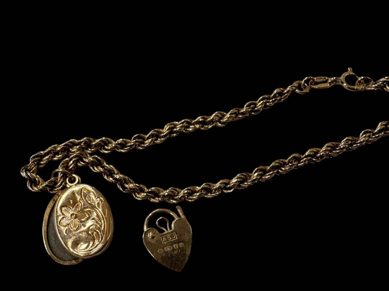 9 carat gold link bracelet, locket and padlock.