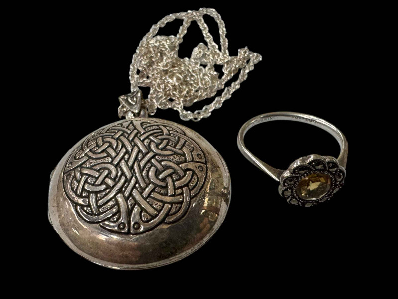 Silver necklace, locket and silver ring.