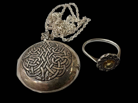 Silver necklace, locket and silver ring.