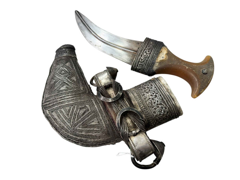 A white metal Jambiya/Khanjar in ornate white metal sheath.