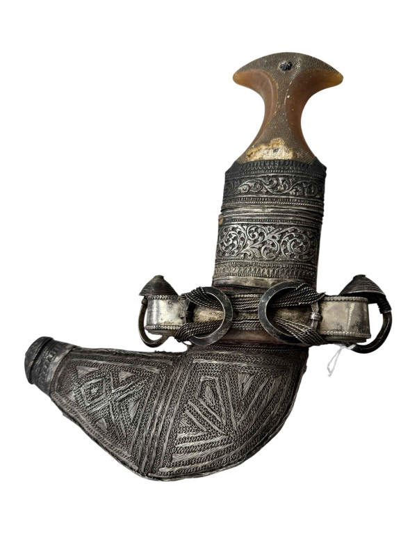 A white metal Jambiya/Khanjar in ornate white metal sheath.