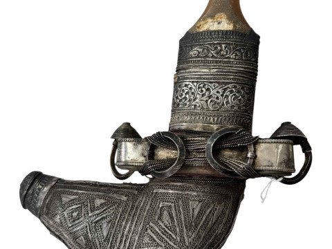 A white metal Jambiya/Khanjar in ornate white metal sheath.
