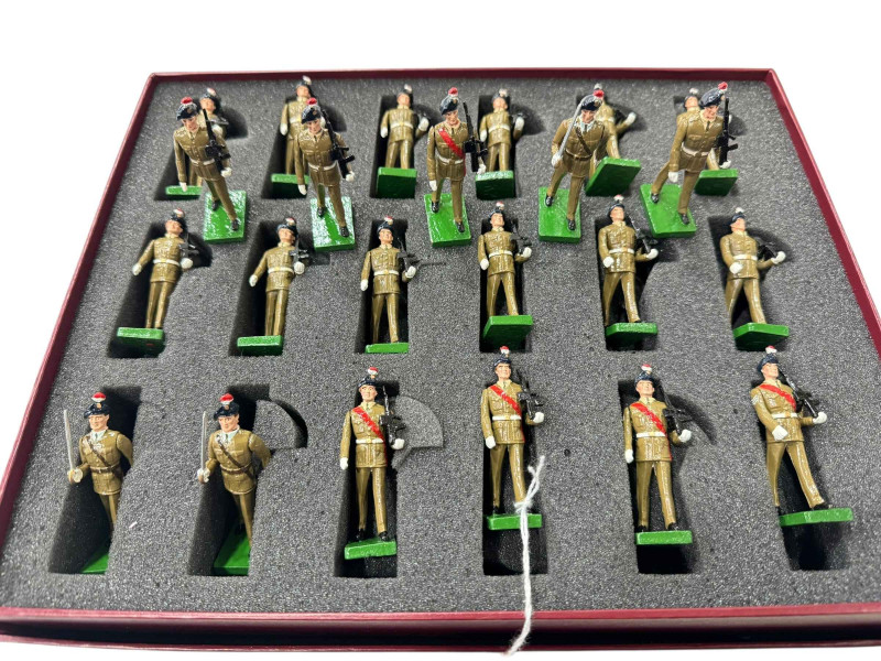 Collection of hand painted cast metal soldiers parading with arms
