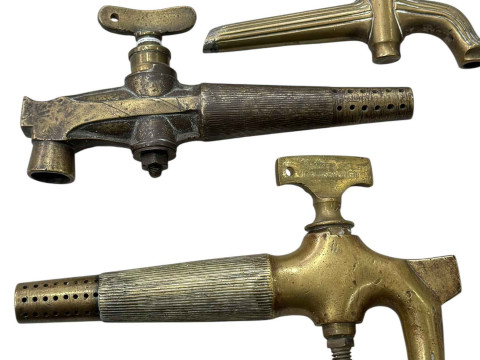 Three brass barrel taps.