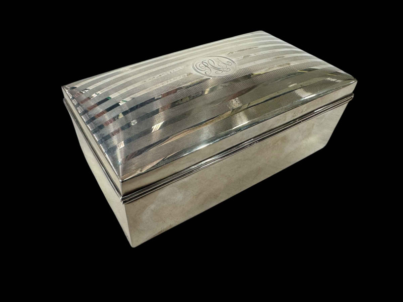 Silver cigarette box, 16cm wide, Birmingham 1945.