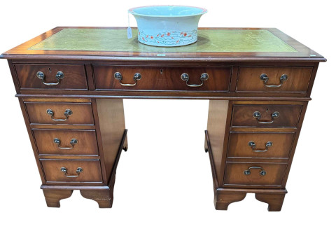 Mahogany eight drawer pedestal desk with gilt tooled green leather inset...