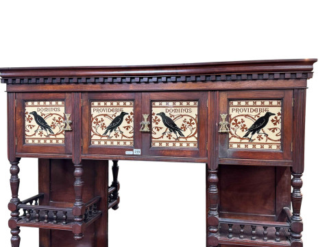 Late Victorian aesthetic mirror backed cabinet having four canopy doors with Minton panels with raven decoration, the base with floral painted panel doors, 198cm by 132cm by 48cm. thumbnail