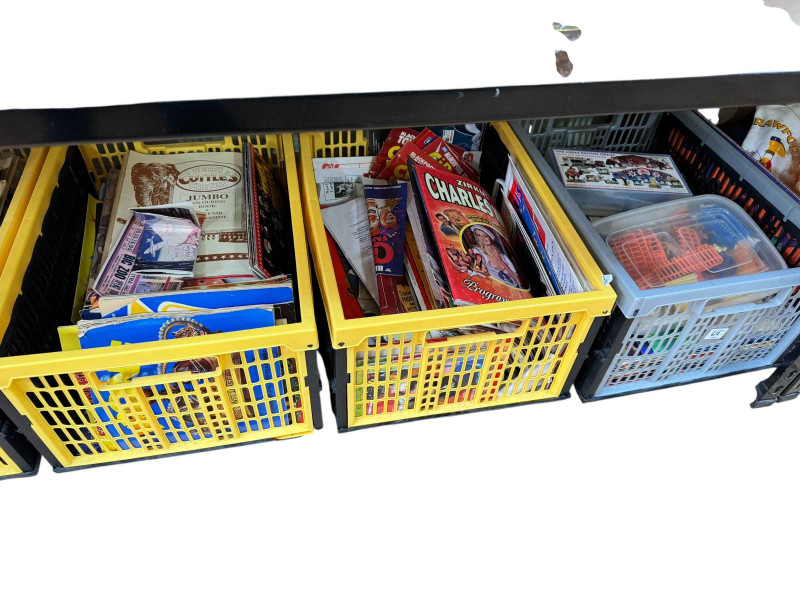 Eight boxes and two suitcases of circus related ephemera, badges and collectables.