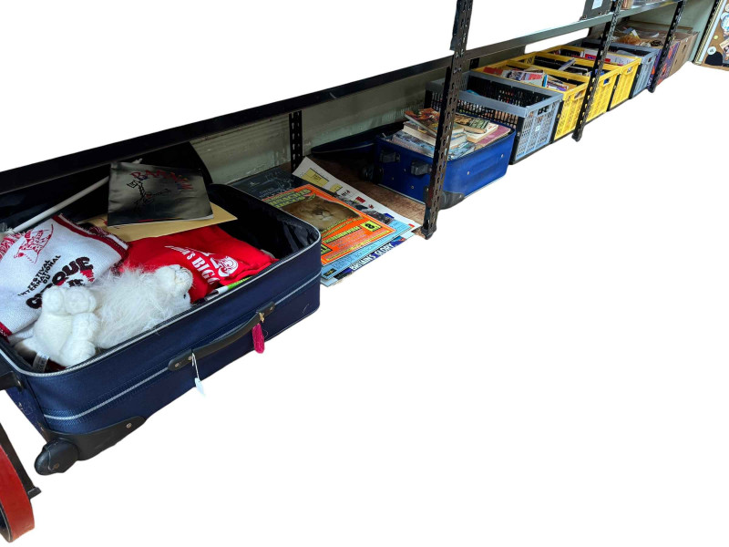 Eight boxes and two suitcases of circus related ephemera, badges and collectables.