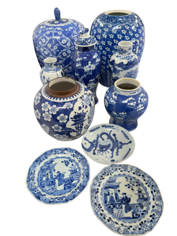 Collection of Chinese blue and white pottery including ginger jars and vases.