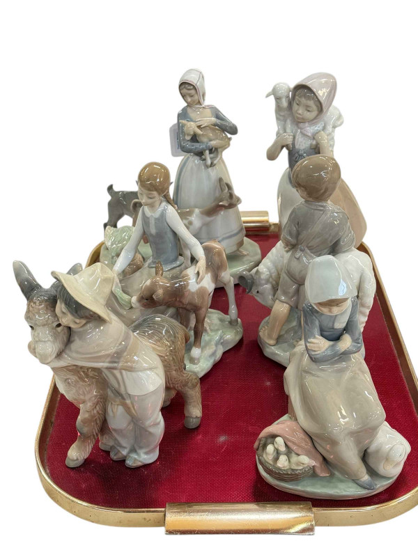 Collection of six Lladro groups including Shepherdess with Goats, Girl with Calf, Boy with Ram and Good Shepherdess.