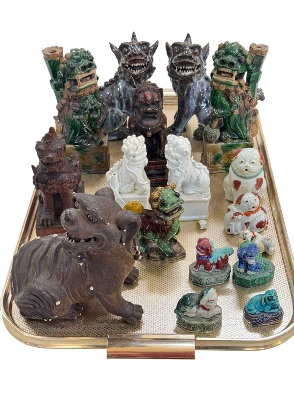 Collection of Chinese Foo Dogs and small pottery animal ornaments.