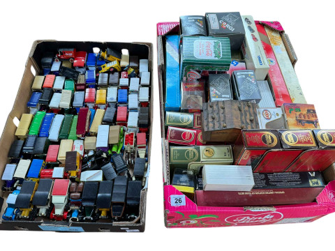Two boxes of boxed and loose model vehicles.