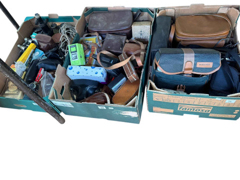 Three boxes of cameras and accessories, binoculars, Harmonica Student...