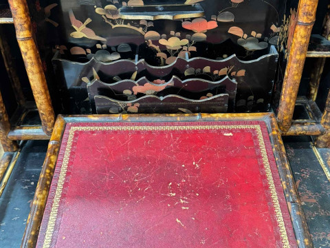 Victorian bamboo and lacquered escritoire, the fall front having leather writing surface and enclosing lacquered stationery compartments, all elevated above three drawer base, with label for Dickins & Jones, Regent St, London, 140cm by 81cm by 52cm. thumbnail