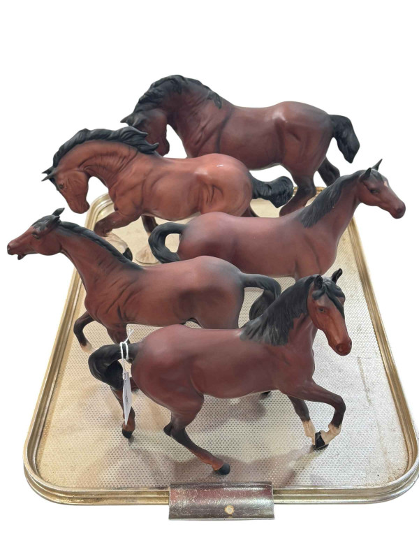 Four Beswick and one Royal Doulton Horses including Shire Horse and Spirit of Earth.