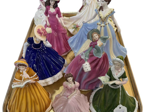 Collection of nine figurines including Coalport and Royal Doulton.