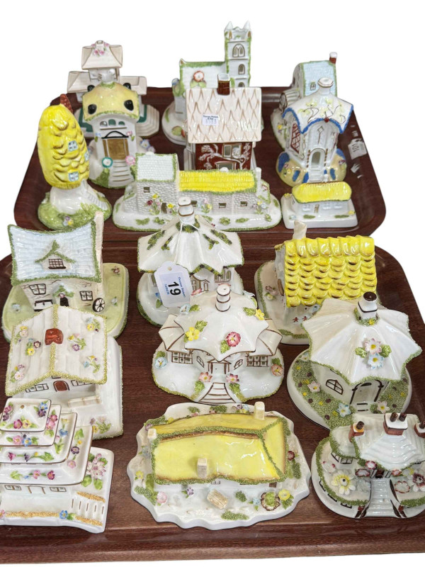 Eighteen Coalport pastel burners and cottages.