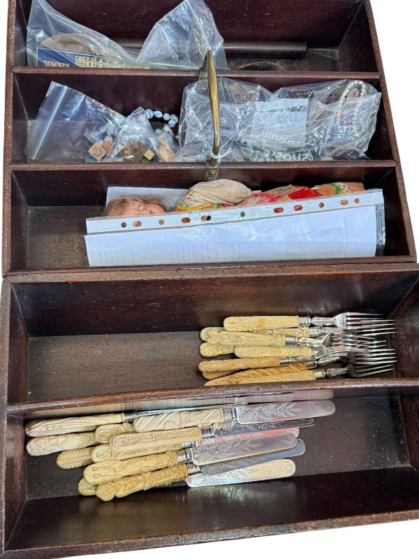 Two mahogany cutlery trays and cutlery, a small Armand Marseilles bisque head doll, walnut box with costume jewellery and brass cased carriage clock with case.