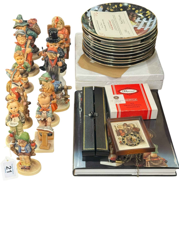 Thirteen Hummel figures, eleven Hummel collectors plates, Hummel album, etc.