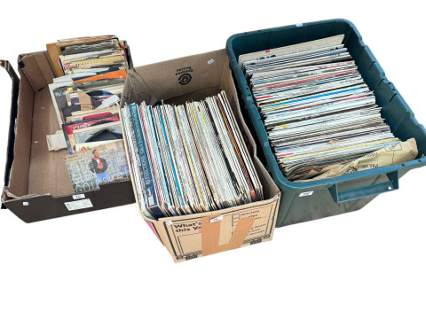 Three boxes of LP and single records.