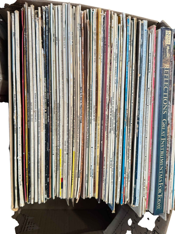 Three boxes of LP and single records.