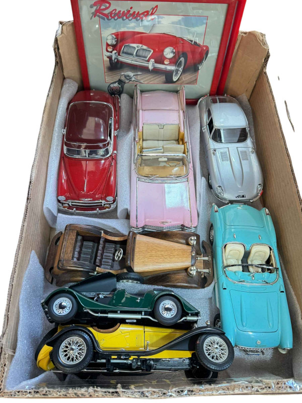 Box of large diecast model cars.