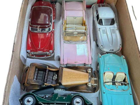 Box of large diecast model cars.