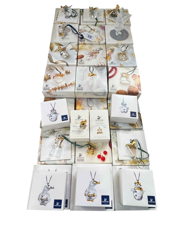 Collection of Swarovski boxed Christmas tree decorations.