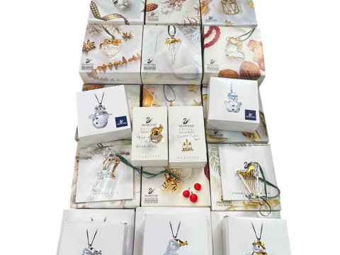 Collection of Swarovski boxed Christmas tree decorations.