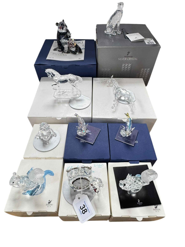 Ten boxed Swarovski Animals and Fish ornaments including Pandas, Baby Giraffe, Cheetah, Horse, two Squirrels, etc.