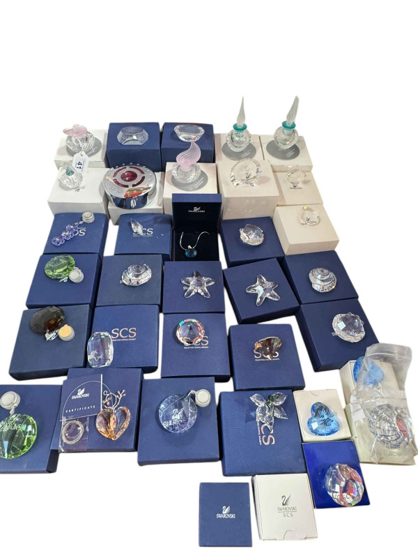 Collection of Swarovski including scent bottles, six sun catchers, two starfish, two shells, etc.