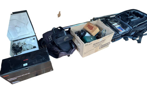 Collection of camera equipment including Nikon D7000 digital camera, Sigma...
