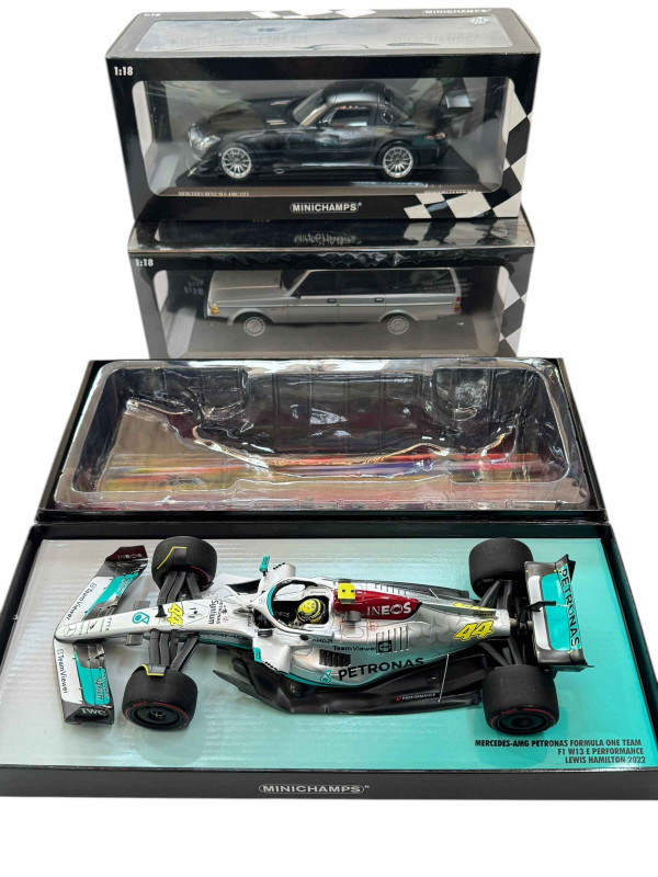 Three Minichamps model vehicles; Mercedes AMG Petronas F1 car, Mercedes Benz SLS AMG GT3 and Volvo 240 GL Break (all boxed).