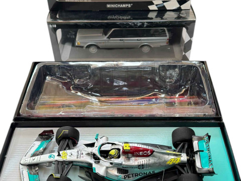 Three Minichamps model vehicles; Mercedes AMG Petronas F1 car, Mercedes...