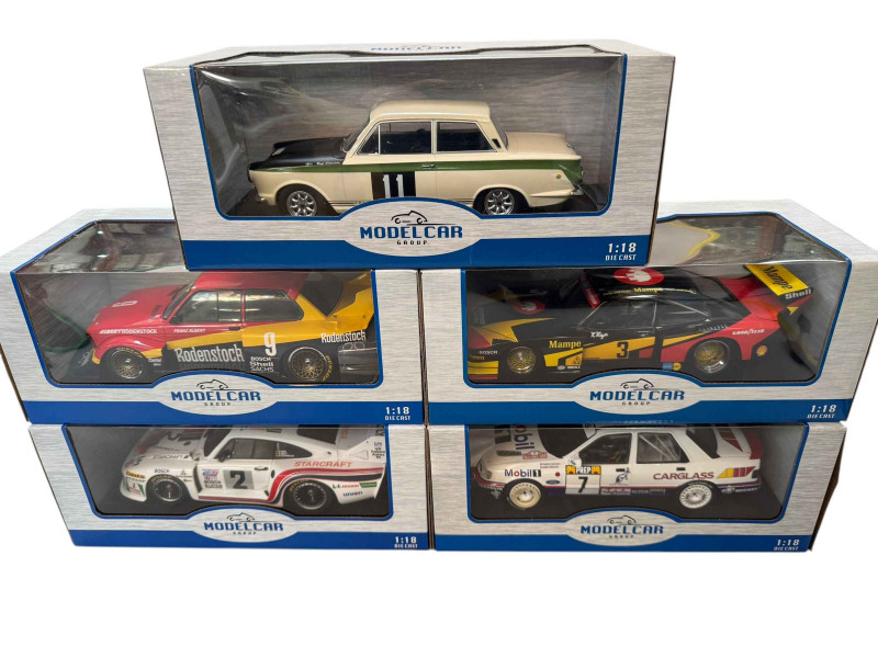 Five Modelcar Group rally car models including BMW 320 GR5, Porsche 935 J and Ford Cortina Lotus (all boxed).