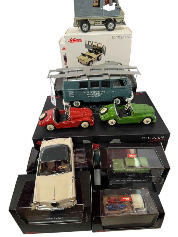 Collection of Schuco model vehicles including Volkswagen T1 Bus and T1 Lowrider, Mercedes Benz 170V and Opel Olympia Caravan (all boxed).