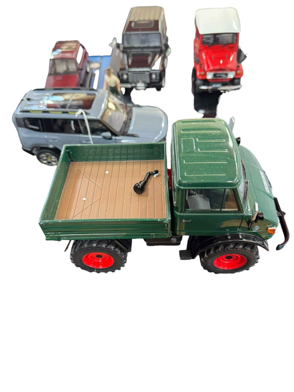 Five various model vehicles including Land Rover Defender 90, Toyota Land Cruiser, Mercedes-Benz Unimog 406 (all boxed).