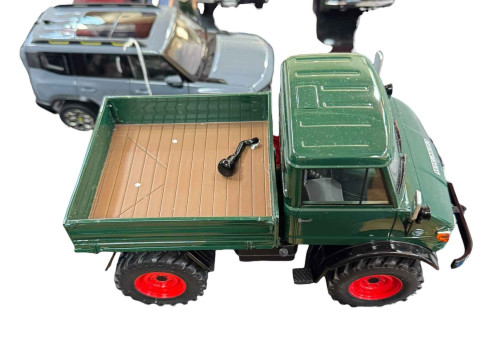 Five various model vehicles including Land Rover Defender 90, Toyota Land...