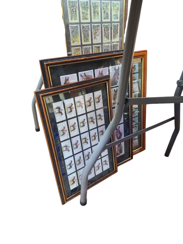 Eleven boxes of collectors cards, annuals, Pokemon cards, assorted tins and framed cigarette cards.