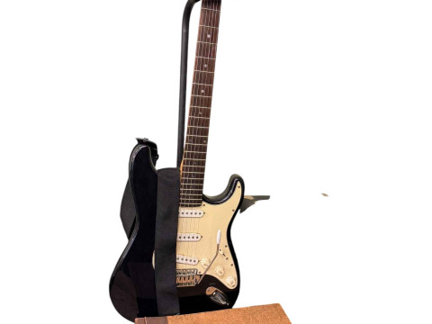 Electric guitar, Squier sp10 amp and two albums of 78rpm records.