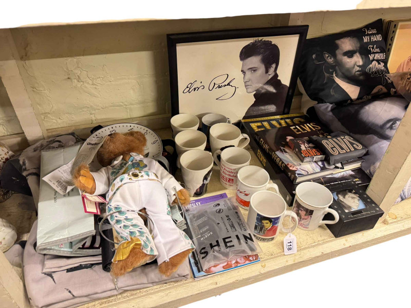 Large collection of Elvis memorabilia including books, cushions, pictures, mugs, telephone, LP records, etc.