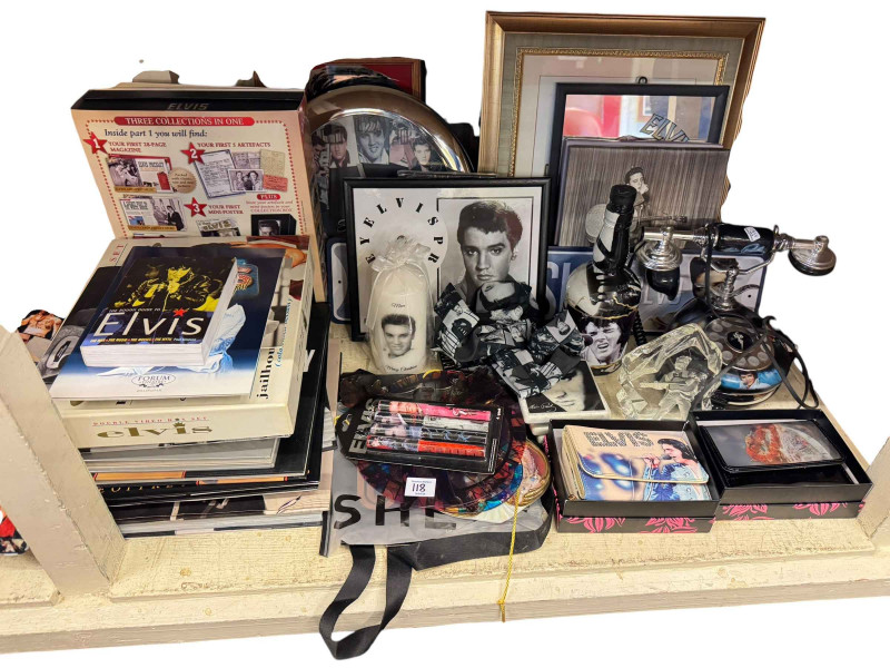 Large collection of Elvis memorabilia including books, cushions, pictures, mugs, telephone, LP records, etc.