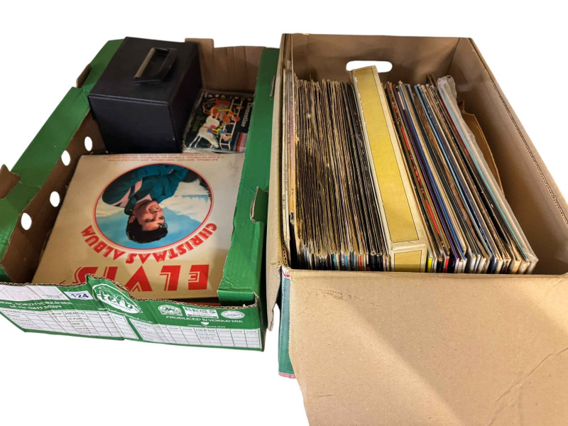 Two boxes of LP records and single records including many Elvis LP's.