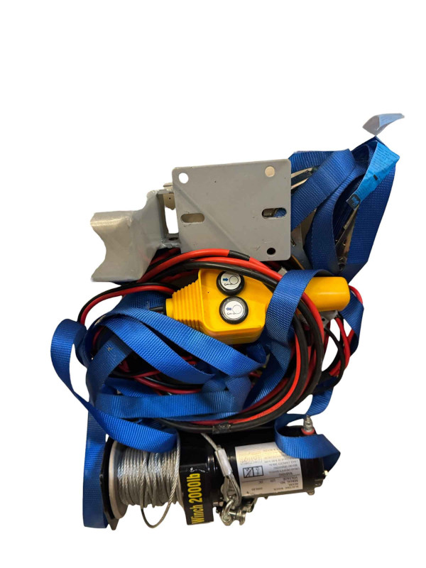 12 Volt powered car winch system with a remote control.