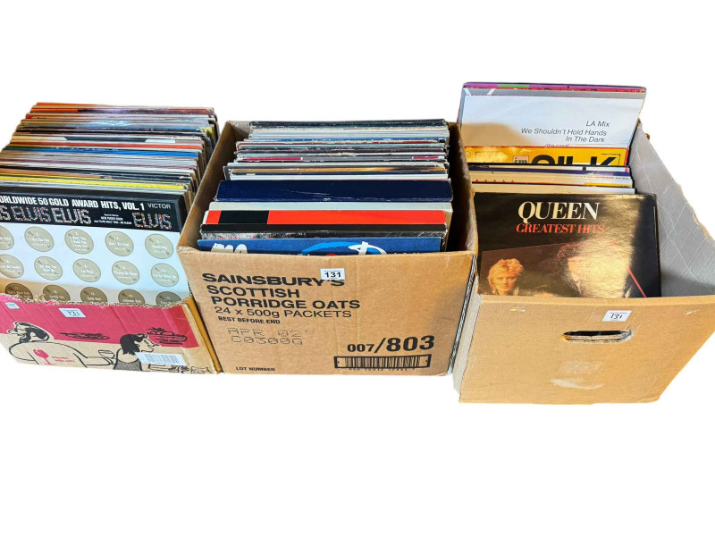 Three boxes of LP records including Queen, Elvis, Elton John and Fleetwood Mac.