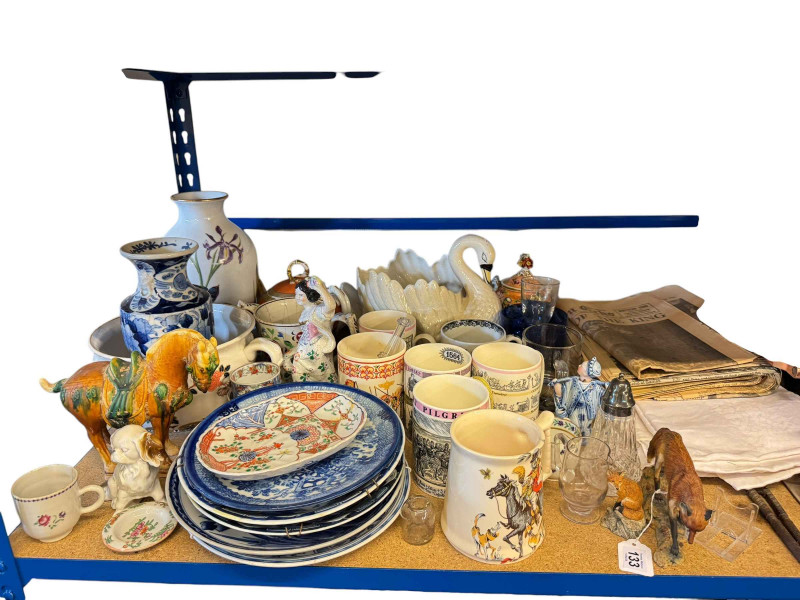 Collection of china including blue and white plates, Wedgwood mugs, Border Fine Arts foxes, vintage newspapers, books, table cloths, pictures, etc.